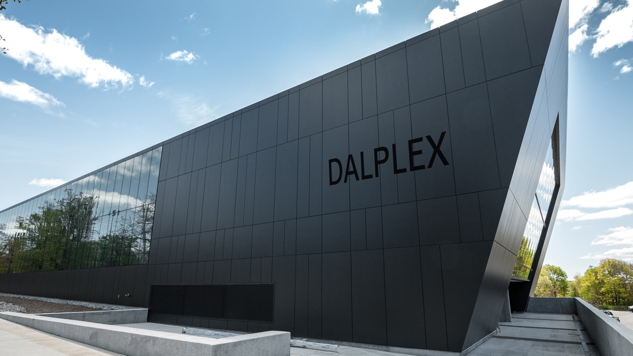The Dalplex building set against a blue sky.