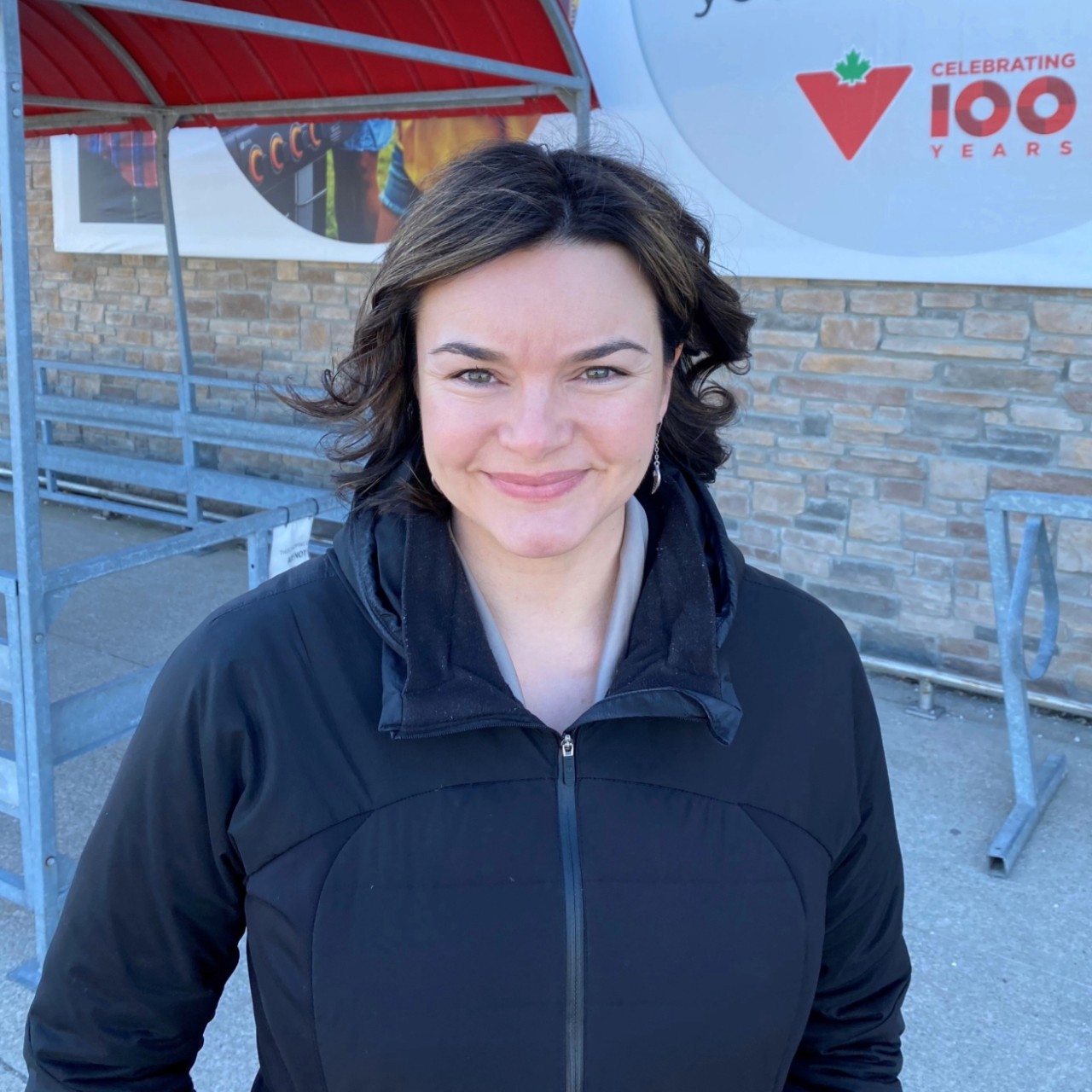 Melanson dressed casually smiling outside a Canadian Tire store.