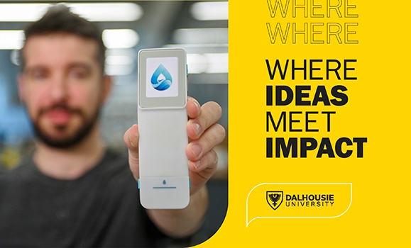 A closeup shot of a handheld digital device with a water drop (the Drinkable Water Solutions logo) on it.